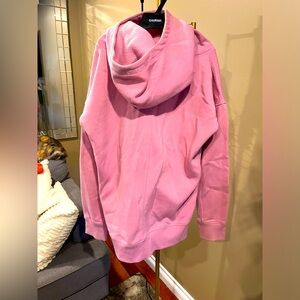 Zyia light pink cowl neck hoodie with thumb holes.